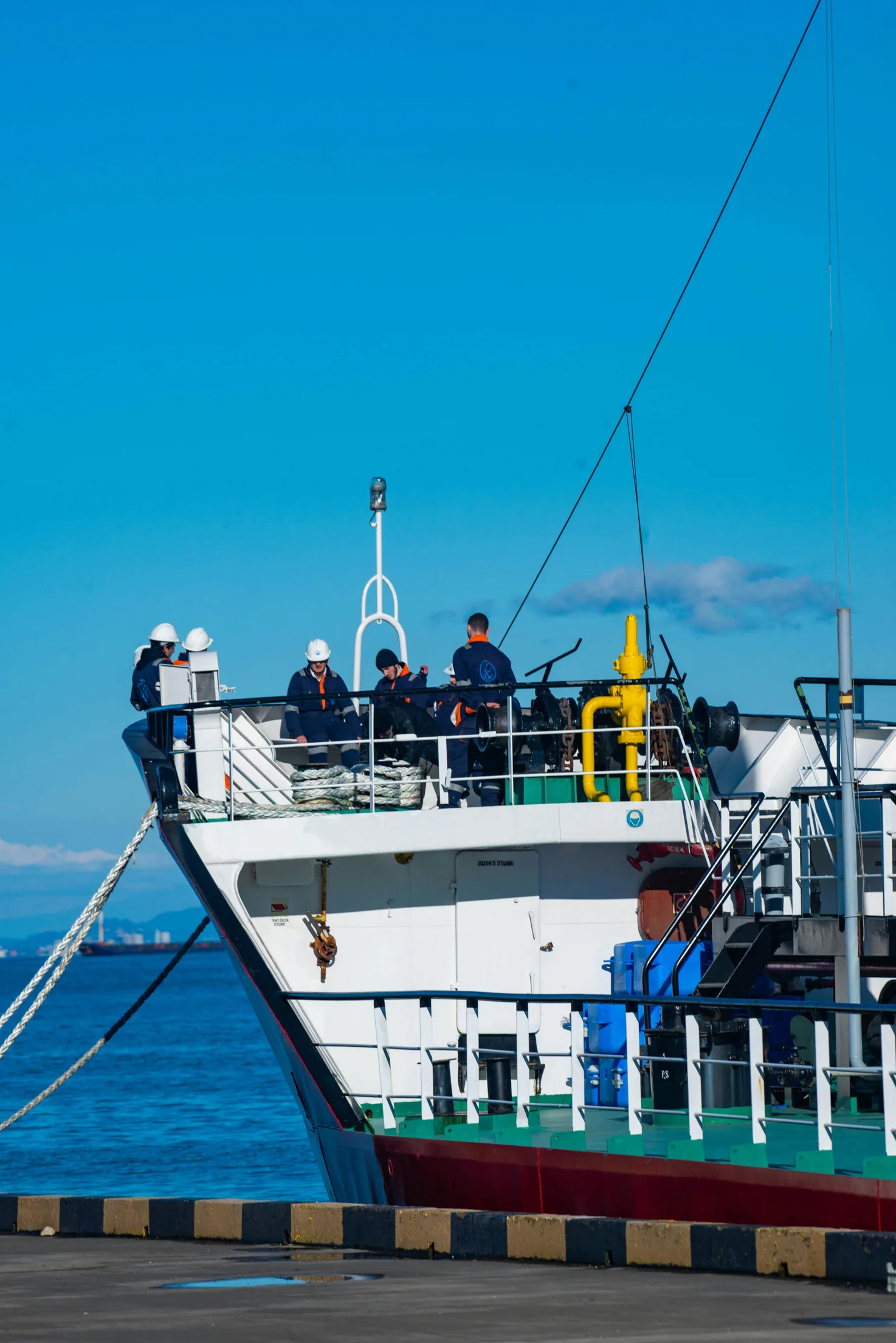 Maritime professionals working onboard a vessel